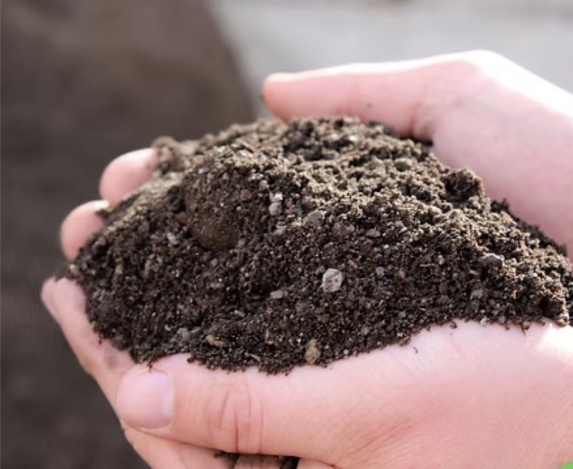Utelite Rootzone Mix soil held in a hand